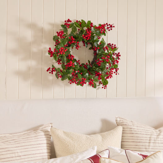 Traditional velvet Christmas wreath hanging on a wall