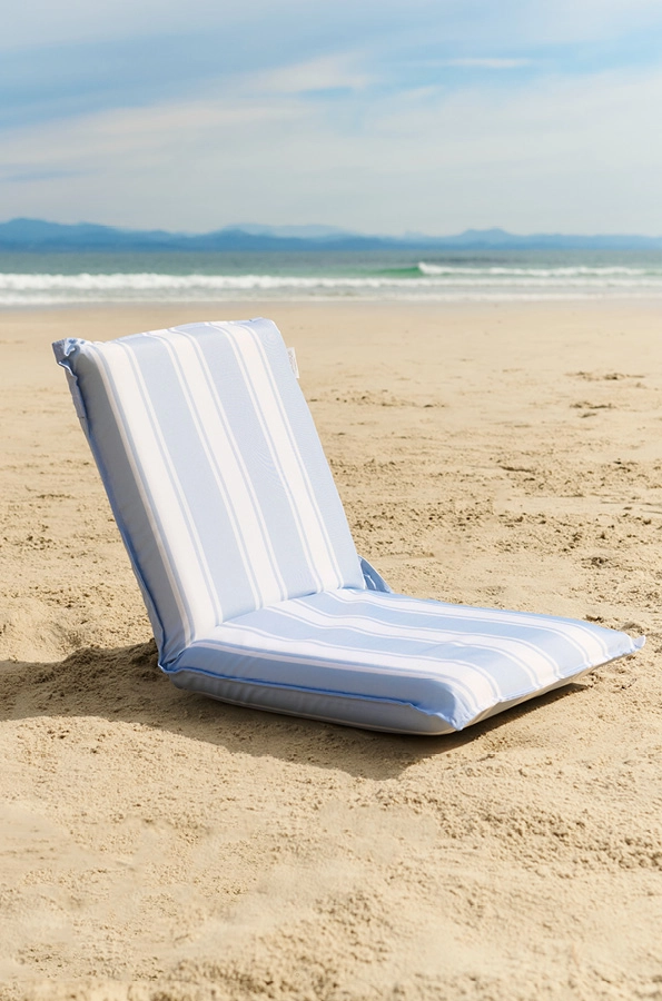 Light blue and white striped beach lounger