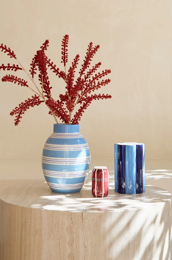 Blue and white striped vases on natural coloured marble block.